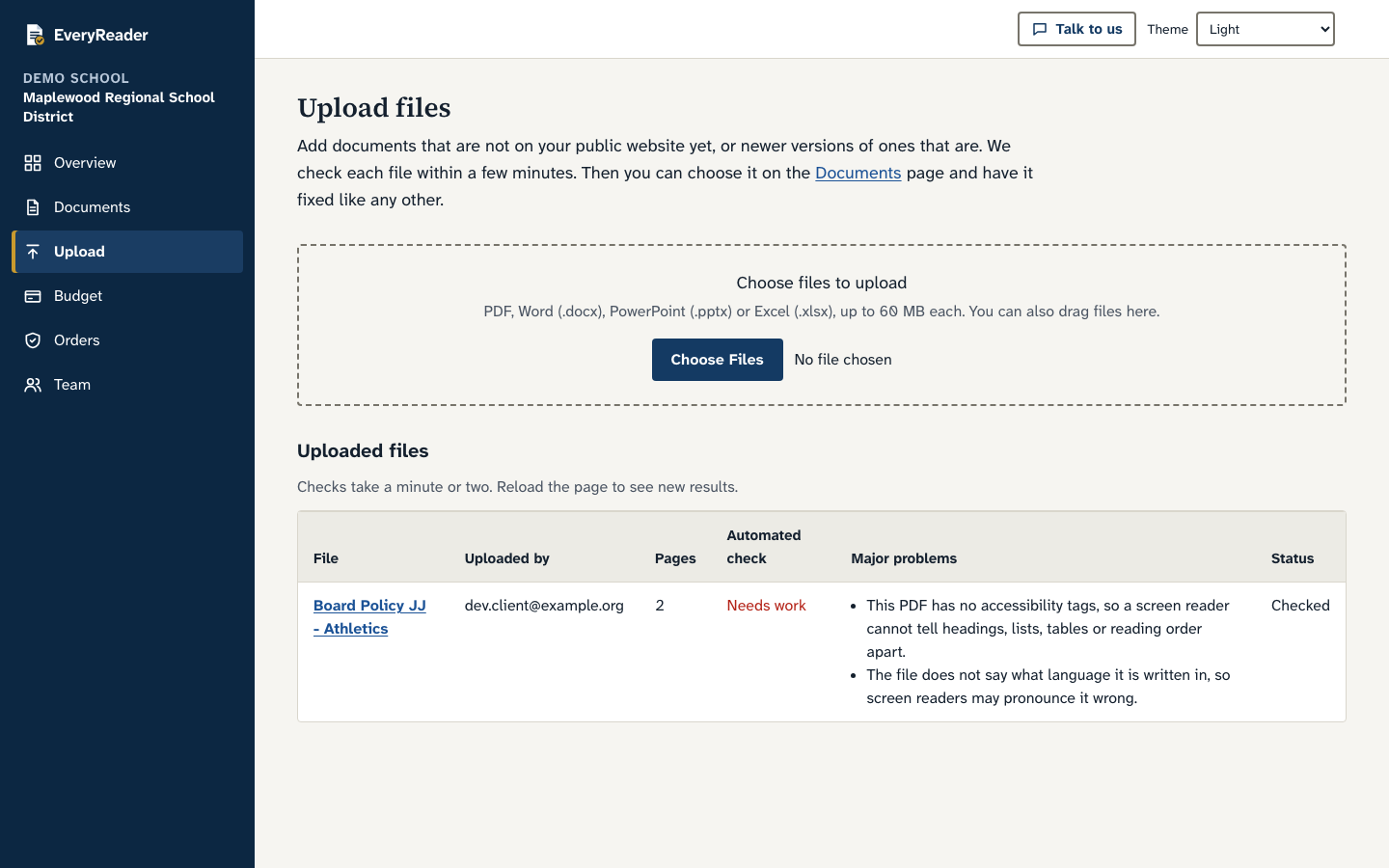 The upload page: a drop area for PDF, Word, PowerPoint and Excel files up to 60 MB, and a table of uploaded files with their check results.